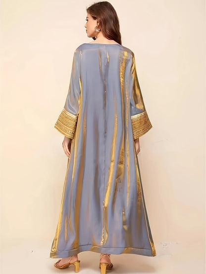 Abaya A Long Dress with a Round Neckline Featuring Directional Reflective Lace Decoration, Elegant Long Sleeves, And a Loose Fit--Color: Gold
