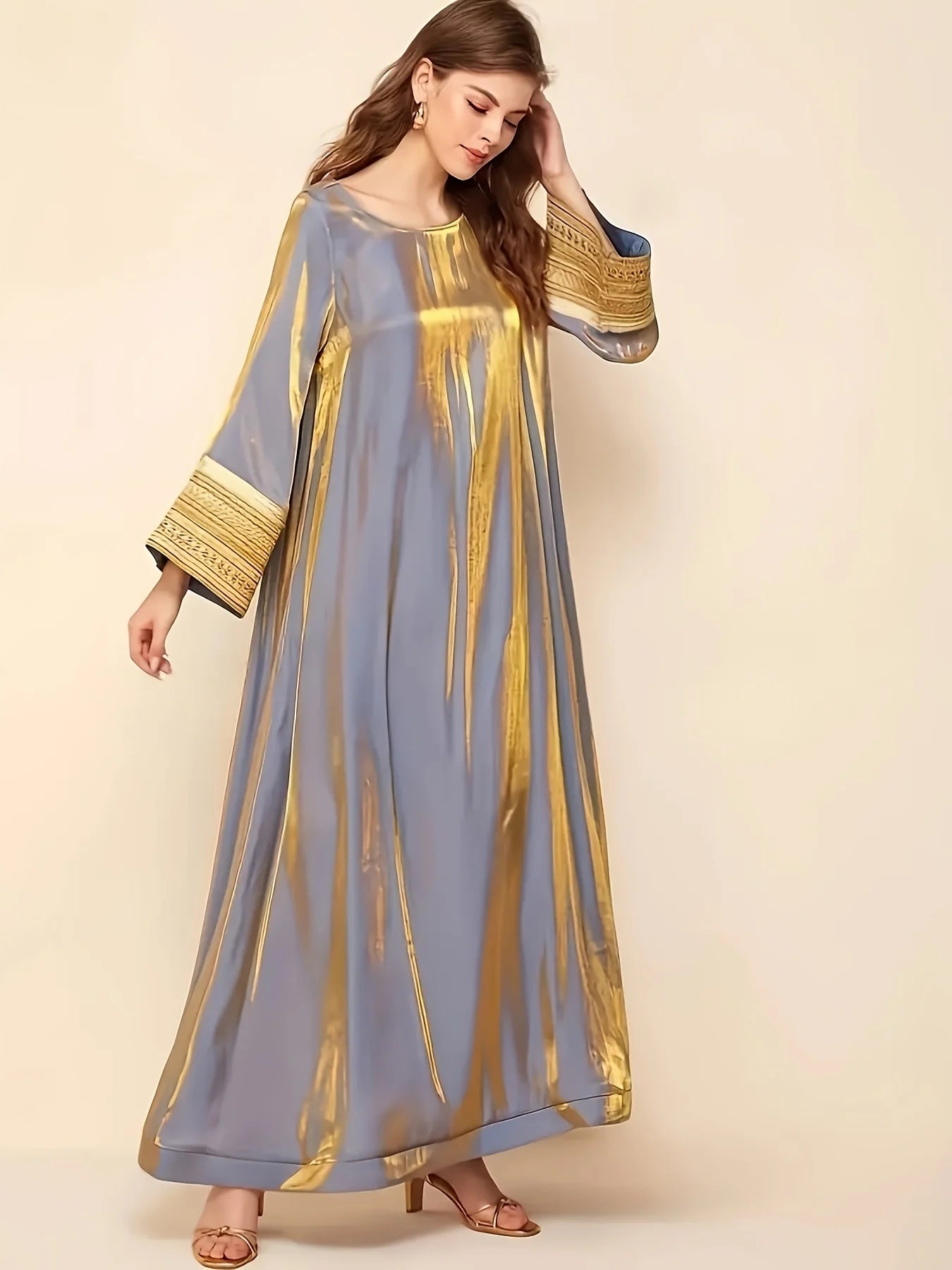 Abaya A Long Dress with a Round Neckline Featuring Directional Reflective Lace Decoration, Elegant Long Sleeves, And a Loose Fit--Color: Gold